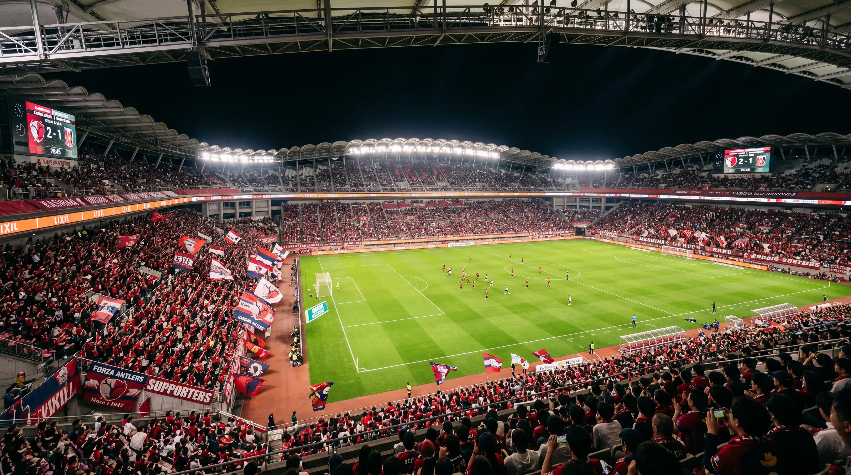 Estadio Kashima Soccer Stadium con el campo de fútbol iluminado durante un partido nocturno